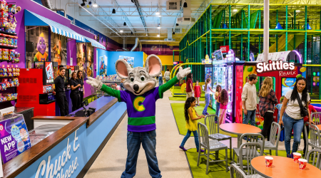 Colorful arcade fun with mascot greeting chukee cheese
